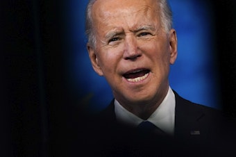 caption: President-elect Joe Biden speaks after the Electoral College formally elected him as president Monday.