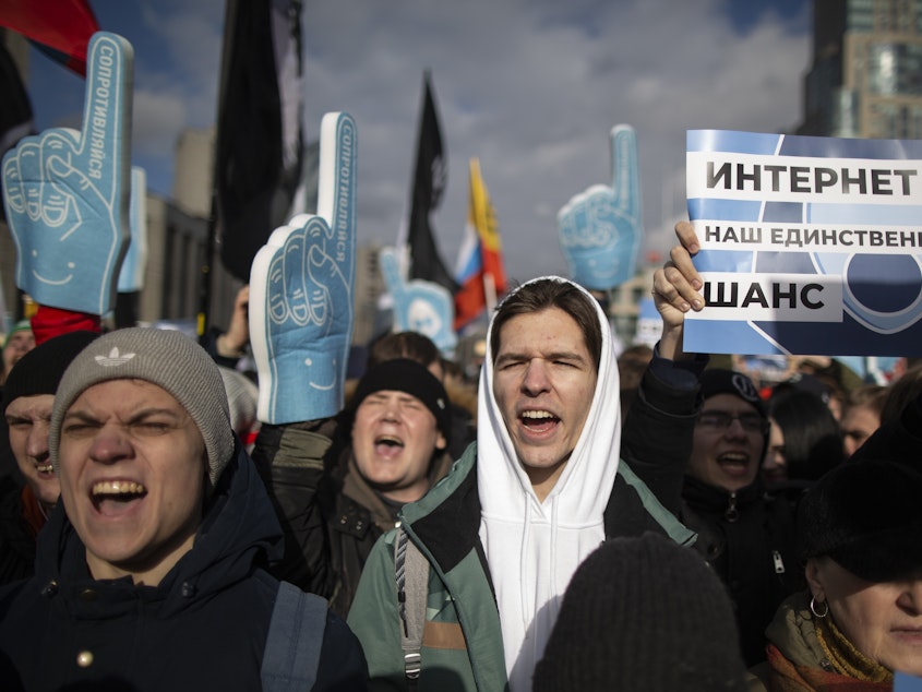 caption: Demonstrators protest at a Free Internet rally in Moscow in March. A new law takes effect on Friday that could restrict Internet access.