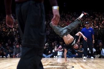 caption: Jordan "Alvin" Medina, a 25-year-old breakdancer from Caracas, Venezuela, performs during the Red Bull Lords of the Floor competition on Saturday, April 6, 2024, at WAMU Theater in Seattle. He and his battle-mate Gibrahimer "Lil G" Beomont were runners-up and represented the crew Team Vinotinto.