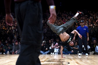 caption: Jordan "Alvin" Medina, a 25-year-old breakdancer from Caracas, Venezuela, performs during the Red Bull Lords of the Floor competition on Saturday, April 6, 2024, at WAMU Theater in Seattle. He and his battle-mate Gibrahimer "Lil G" Beomont were runners-up and represented the crew Team Vinotinto.