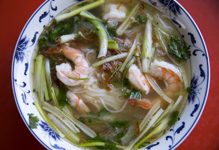 caption: Pho with cilantro, onion, green onion, prawns, noodles, fried shallots and beef broth. Tap to see more photos.