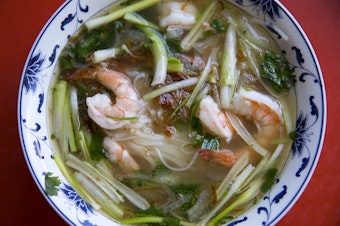 caption: Pho with cilantro, onion, green onion, prawns, noodles, fried shallots and beef broth. Tap to see more photos.