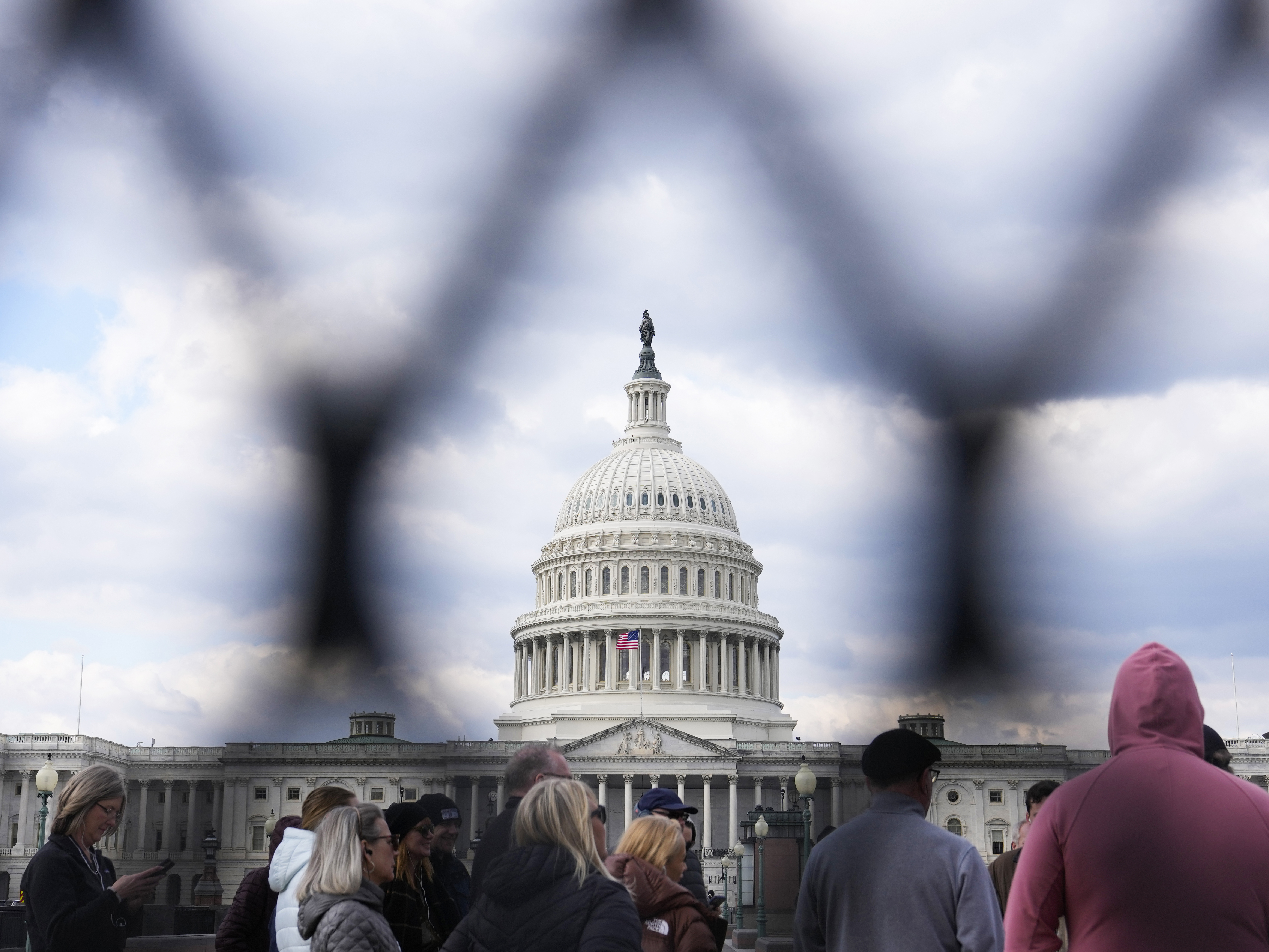 caption: A perimeter fence surrounds the U.S. Capitol in February ahead of President Biden's State of the Union speech in Washington, D.C.