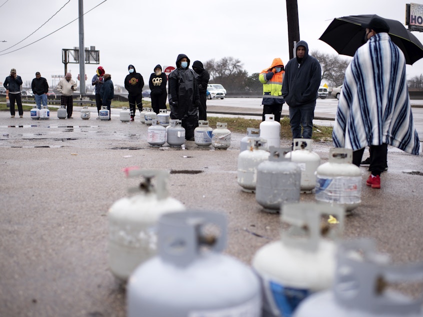 caption: People in Houston wait in line to fill their propane tanks on Wednesday amidst widespread power outages related to the winter storm. Cases of carbon monoxide poisoning in the state have increased in recent days, with officials attributing most to the improper use of heating devices like charcoal grills and portable generators.