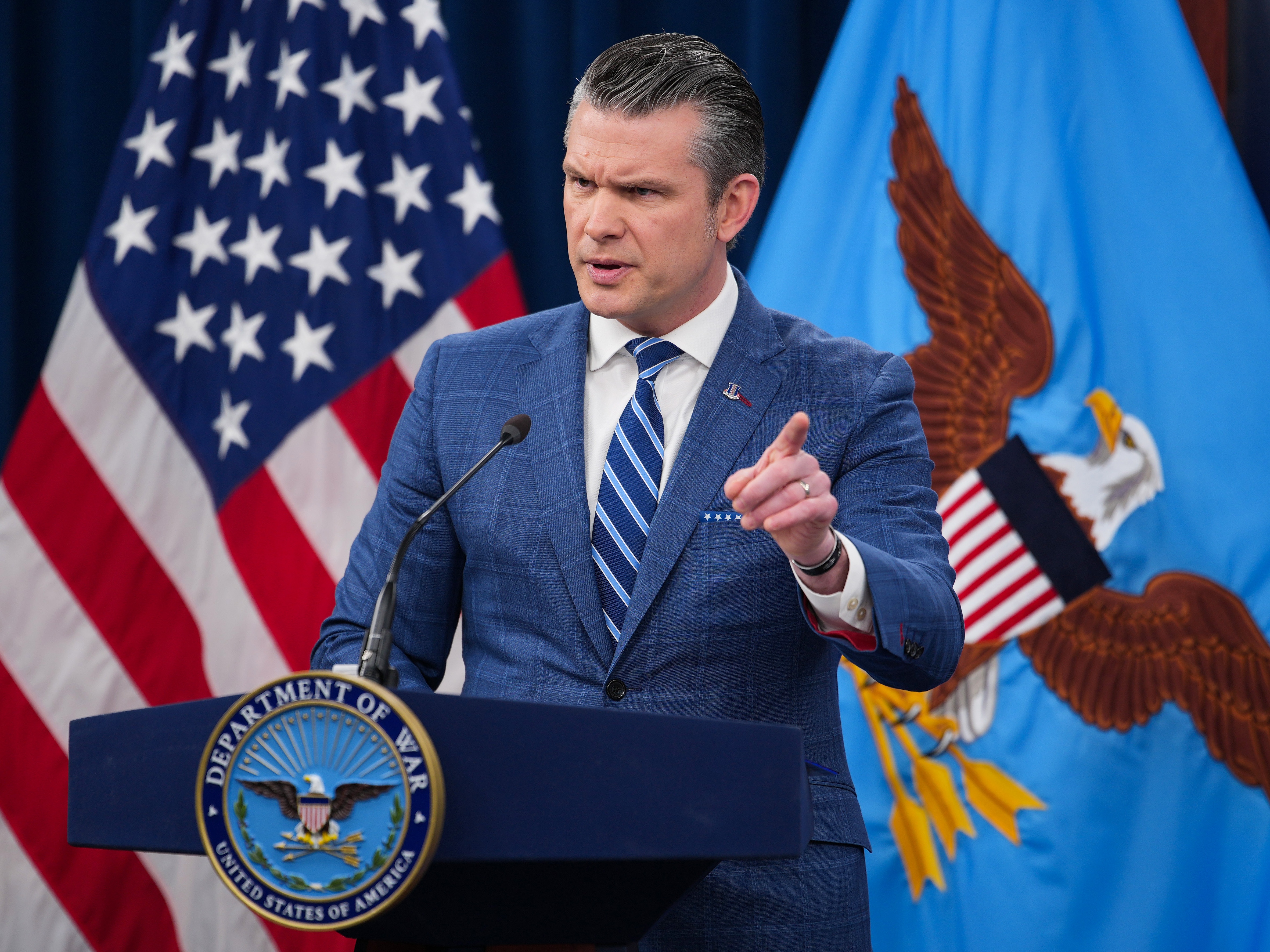 caption: Secretary of Defense Pete Hegseth speaks during a news briefing at the Pentagon on Wednesday. President Trump's stated goals for the Iran war look mostly unmet.