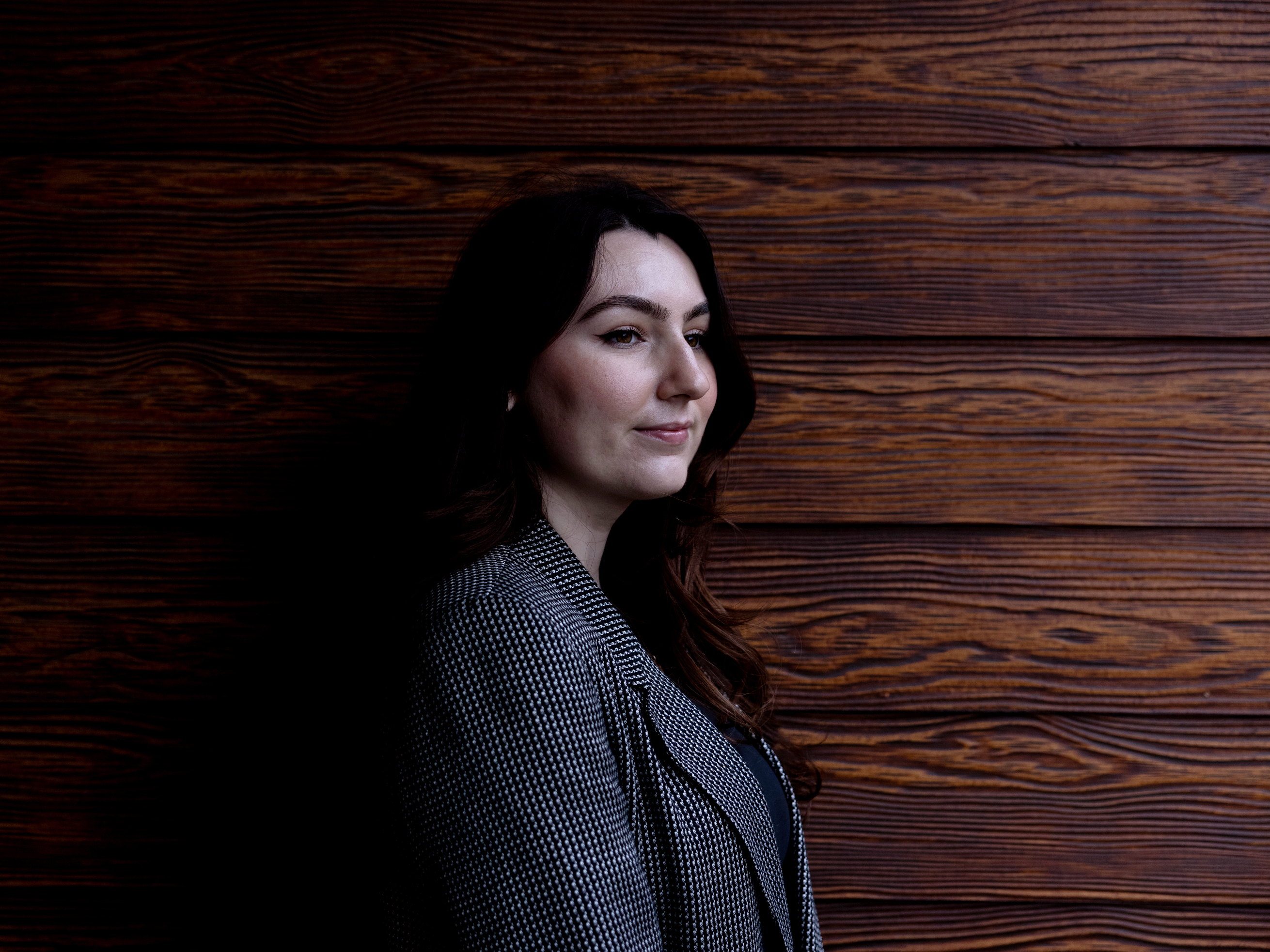 caption: Emma Alexander was recently laid off from Goldman Sachs, along with over 3,000 other employees. Although the layoffs were unusually large this year, they are an ever-lurking prospect for people who work in finance.