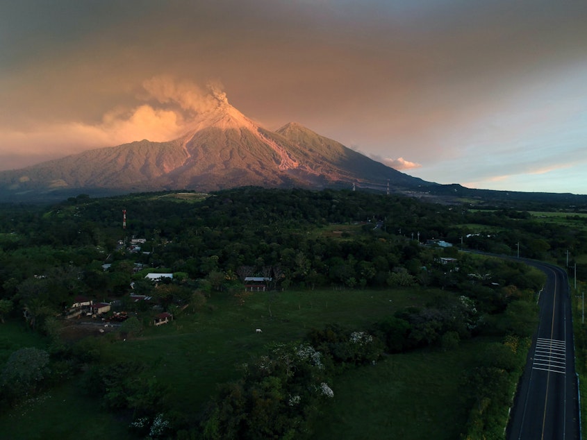 caption: The Volcano of Fire spewed lava and ash on Monday, as seen from Escuintla, Guatemala. Guatemalan authorities on Monday declared a red alert after the volcano erupted again, forcing thousands of residents to flee.