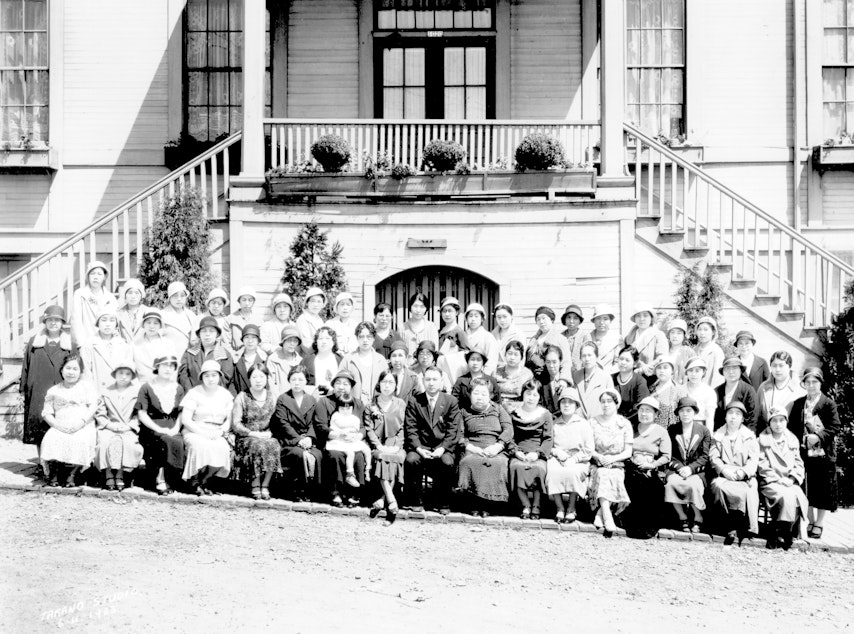 caption: Members of Women's Buddhist Association, in front of the Seattle Buddhist Temple at 1020 Main Street, in 1933. The temple is currently located at 1427 South Main Street.