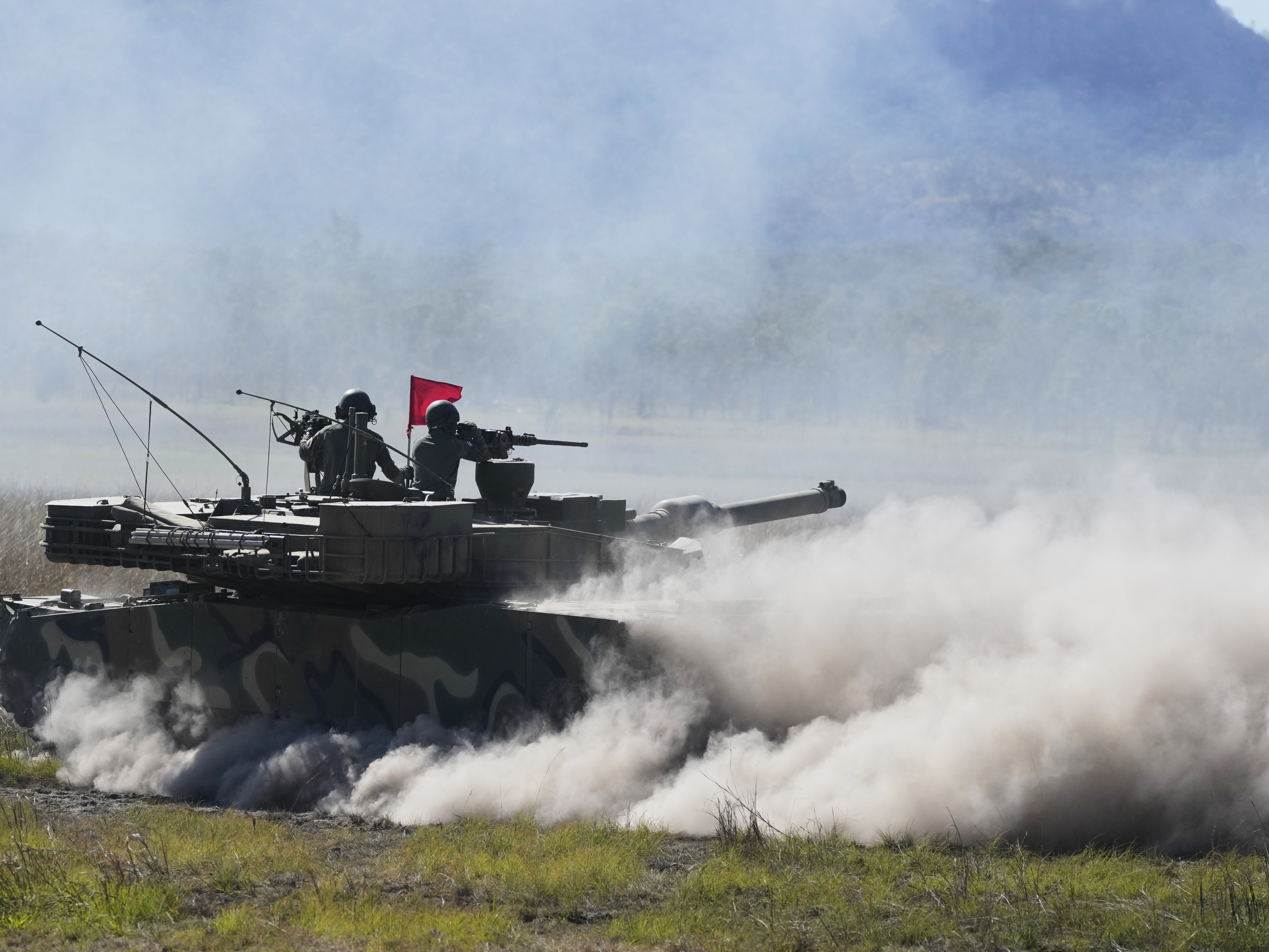caption: South Korean soldiers fire from a K1 tank during Exercise Talisman Sabre 2025, Australia's largest-ever war fighting drills at Shoalwater Bay Training Area, near Rockhampton, Australia, on Monday.