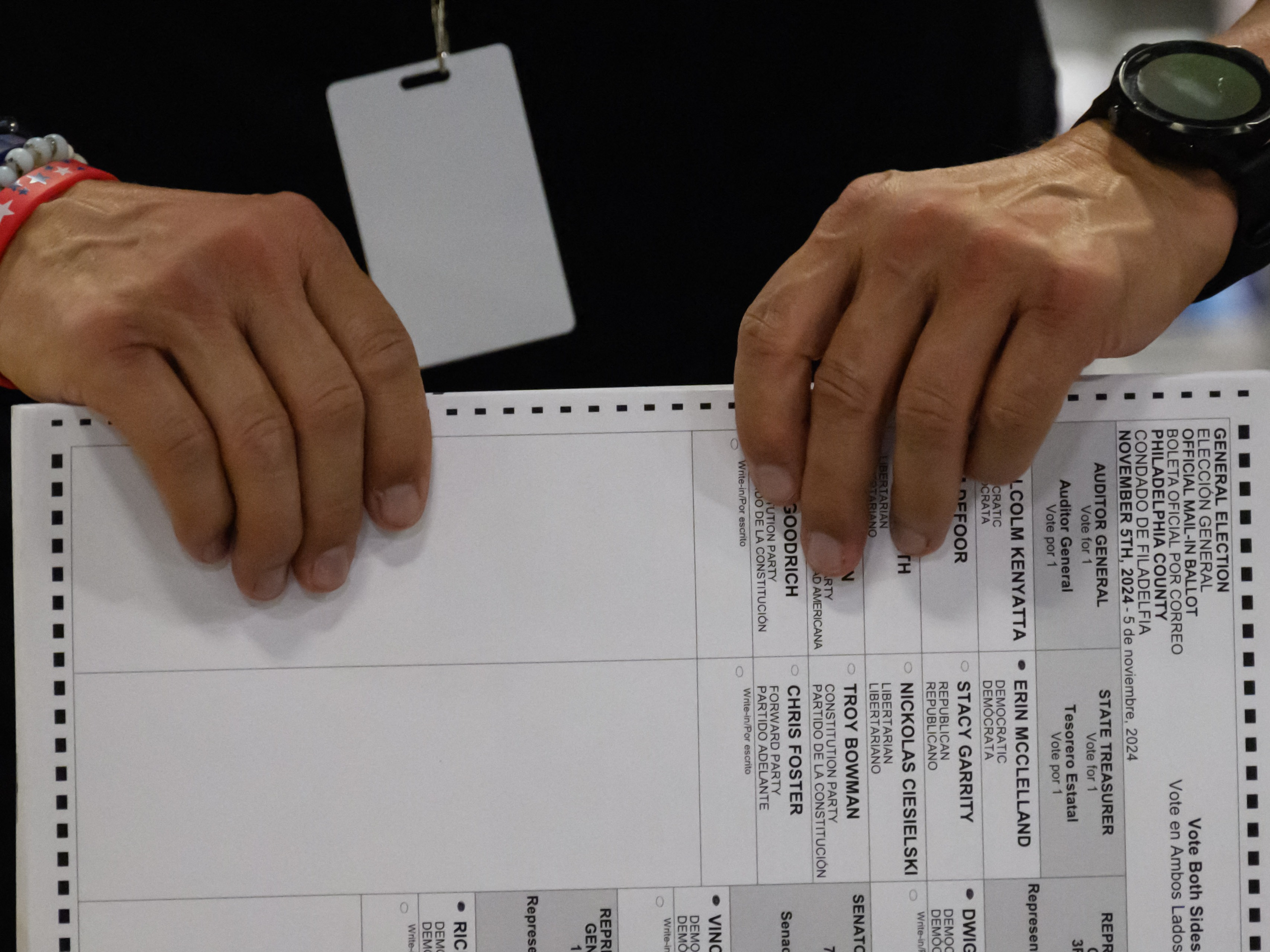 caption: Philadelphia county board of elections staff processing ballots on Election Day at the ballot counting elections warehouse on the outskirts of Philadelphia, Pa., on Nov. 5, 2024.