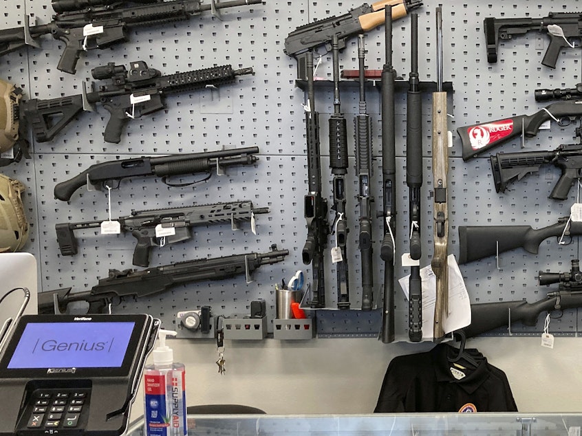 caption: Firearms are displayed at a gun shop in Salem, Ore., on Feb. 19, 2021.