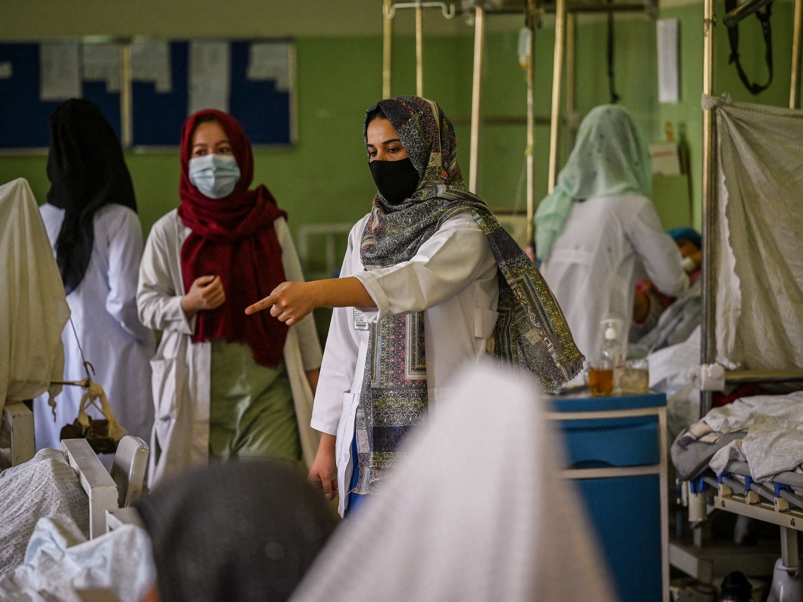 caption: Nurses caring for patients at Wazir Akbar Khan hospital in Kabul on September 1, 2021. Since assuming power that year, the Taliban has curtailed educational opportunities for women. This week they reportedly banned women from studying nursing and midwivery.