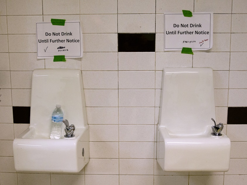 caption: Drinking fountains are marked "Do Not Drink Until Further Notice" at Flint Northwestern High School in Flint, Mich., in May 2016. After 18 months of insisting that water drawn from the Flint River was safe to drink, officials admitted it was not.
