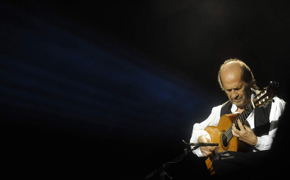 caption: Spanish guitarist Paco de Lucia performs on stage during the 37th Jazz Festival of Vitoria on July 20, 2013 in the northern Spanish Basque city of Vitoria. (Rafa Rivas/AFP via Getty Images)