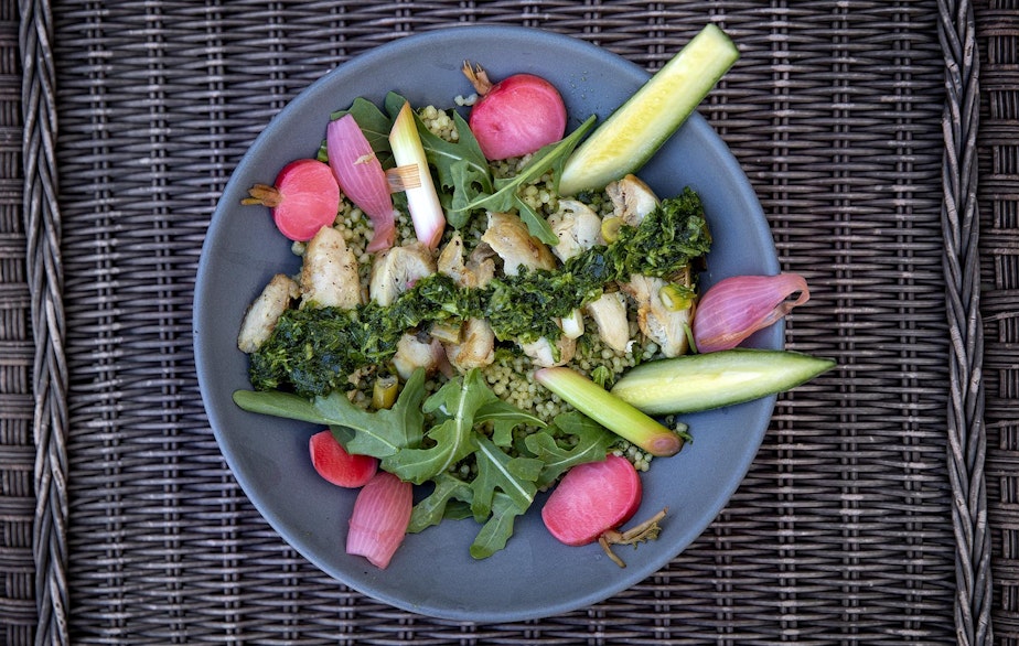 caption: Chef Kathy Gunst’s chicken and couscous bowl with green cilantro-scallion sauce. (Robin Lubbock/WBUR)