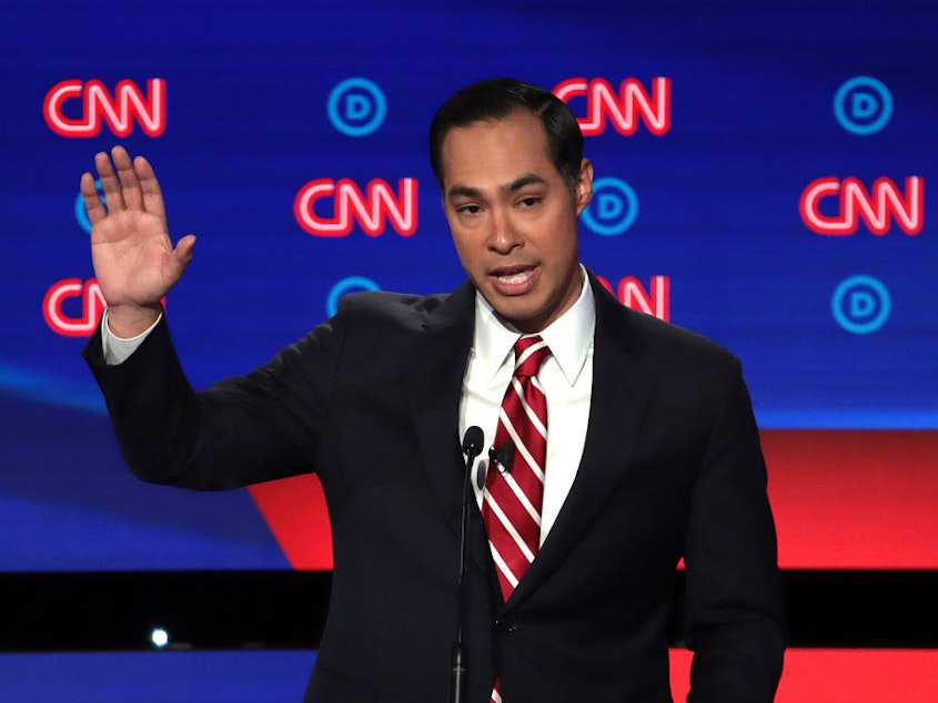 caption: Former HUD Secretary Julian Castro has qualified for the September Democratic primary debate in Houston.