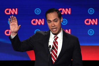 caption: Former HUD Secretary Julian Castro has qualified for the September Democratic primary debate in Houston.
