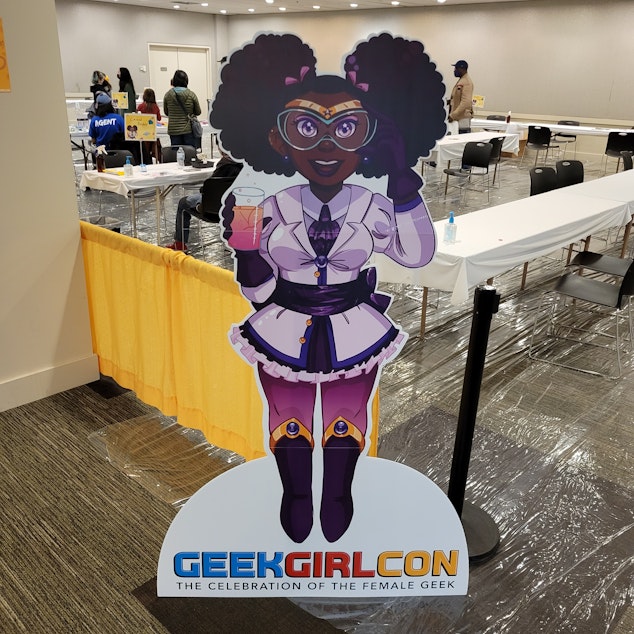 caption: The Celebration of the Female Geek science standee at GeekGirlCon 2022