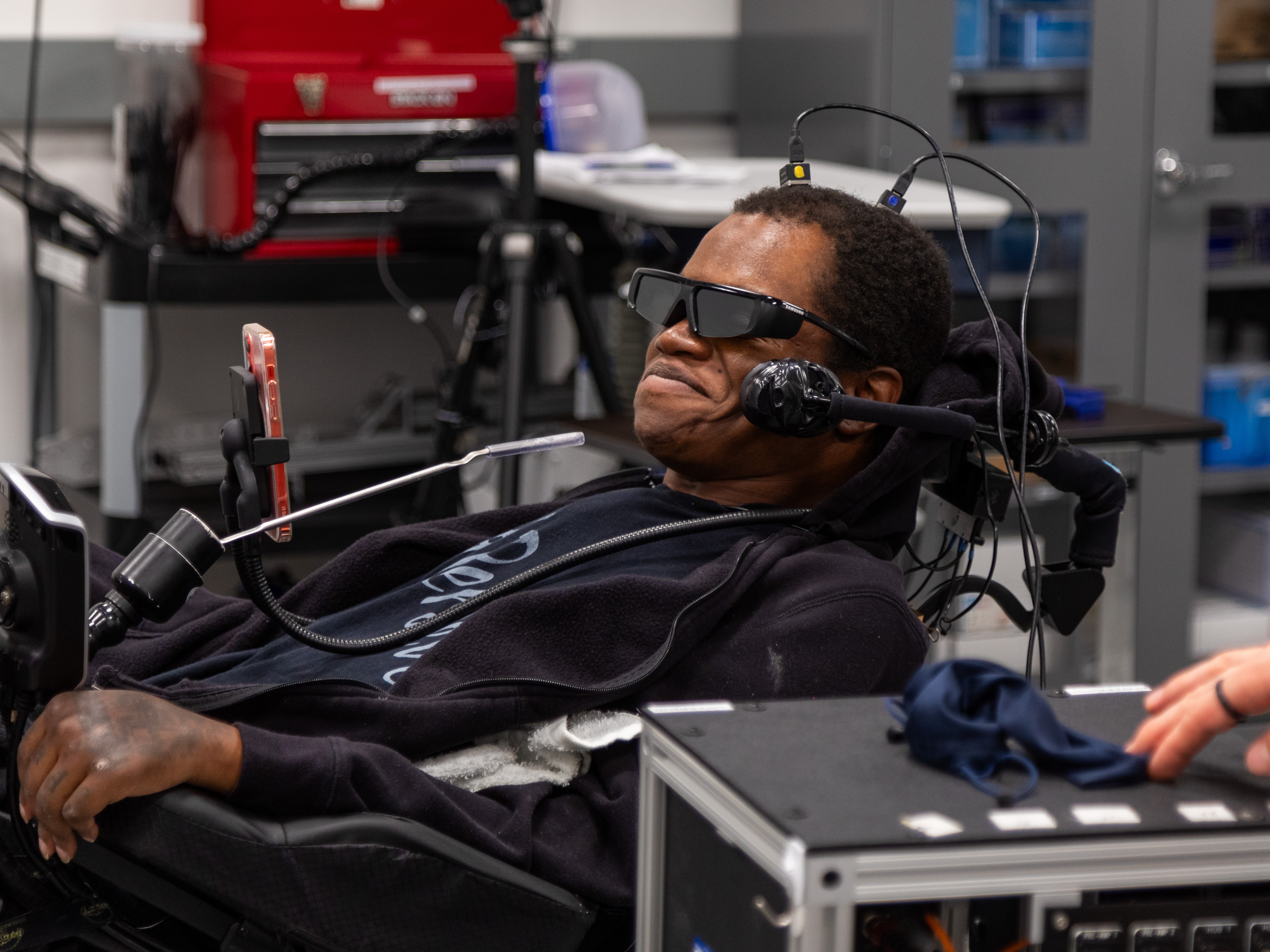 caption: Phillip McKenzie, who was paralyzed from the neck down in a fall in 2012, uses a brain-computer interface developed by researchers at the University of Pittsburgh to navigate complex virtual tasks that simulate everyday activities,