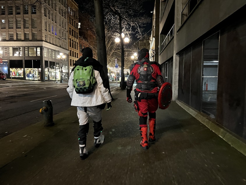 caption: Justin Service (left) and Red Ranger (right) patrol the streets for crime in Seattle's Pioneer Square.