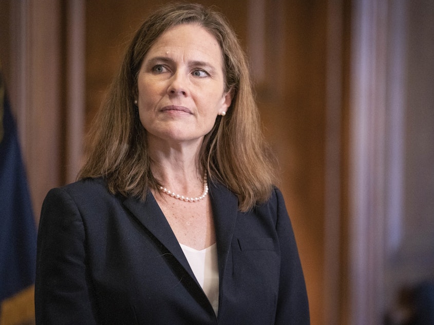 caption: In a near-party-line vote Sunday, Senate Republicans advanced President Trump's Supreme Court nominee, Judge Amy Coney Barrett, seen here on Capitol Hill on Wednesday. A final confirmation vote is set for Monday evening.