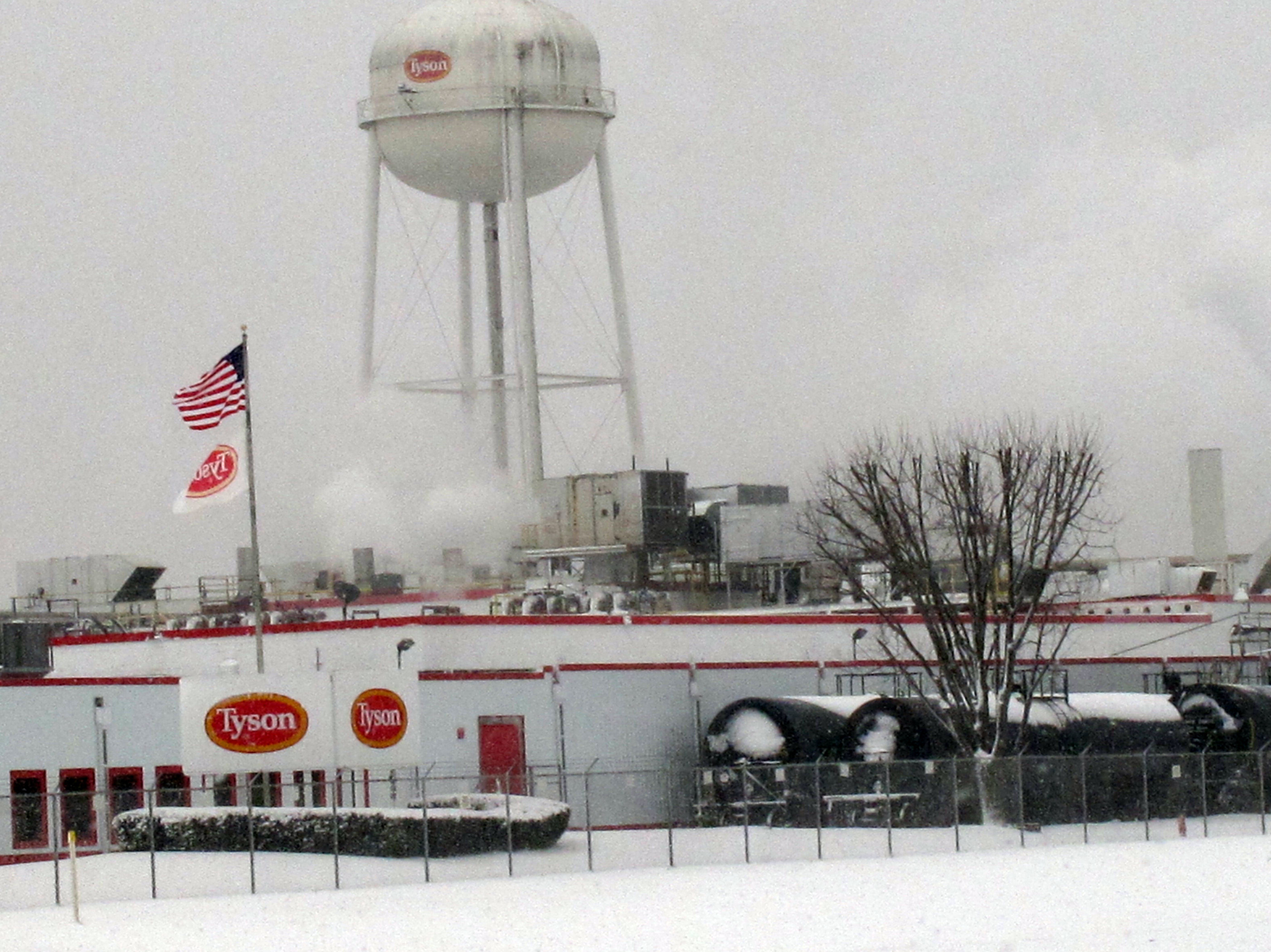 caption: Tyson Foods says it has suspended operations at its pork plant in Columbus Junction, Iowa, pictured in February 2013, after more than two dozen workers got sick with COVID-19.