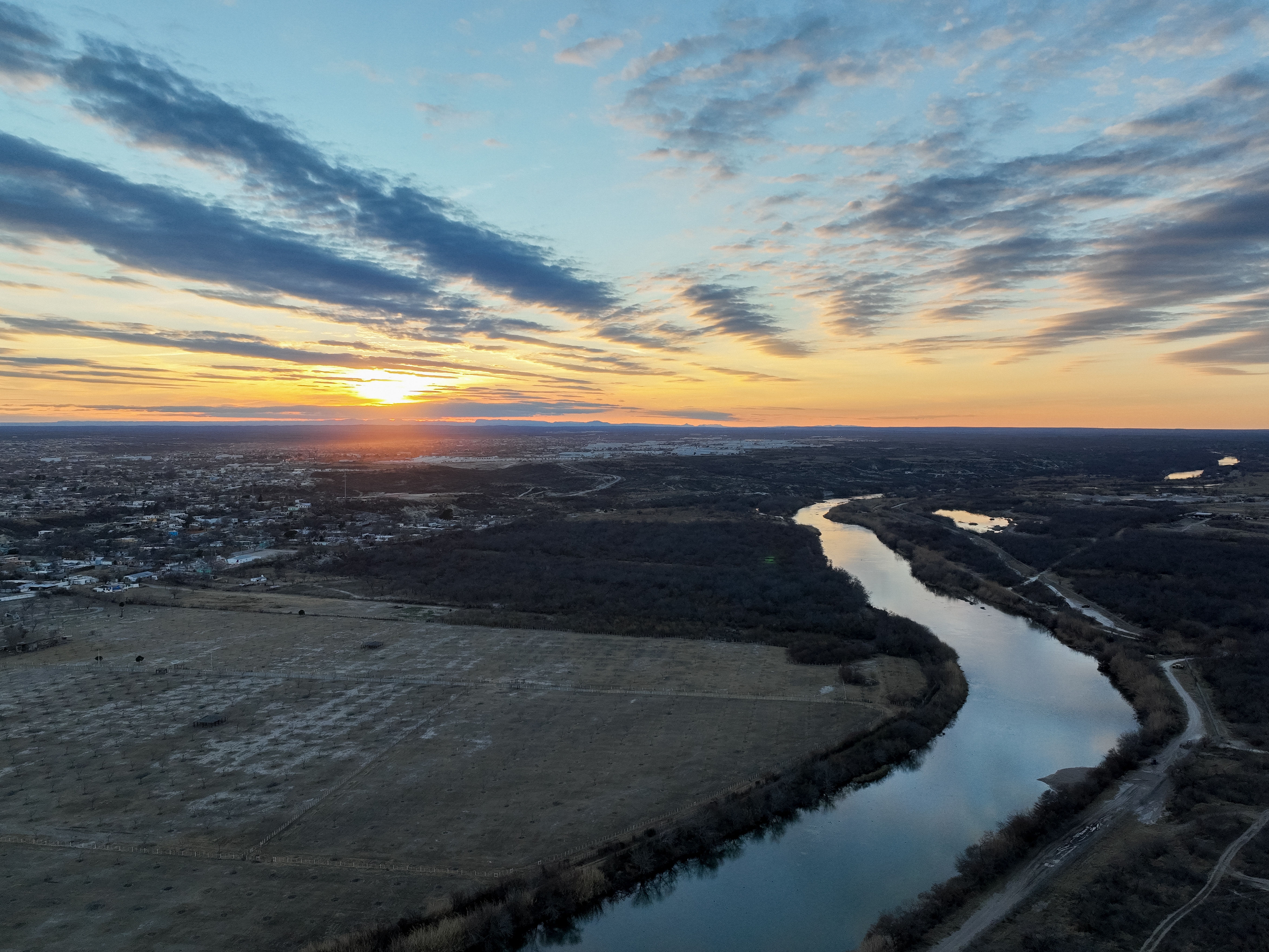 caption: The Rio Grande is shown between the border towns of Del Rio, Texas, and Ciudad Acuña, Mexico, in January 2023.