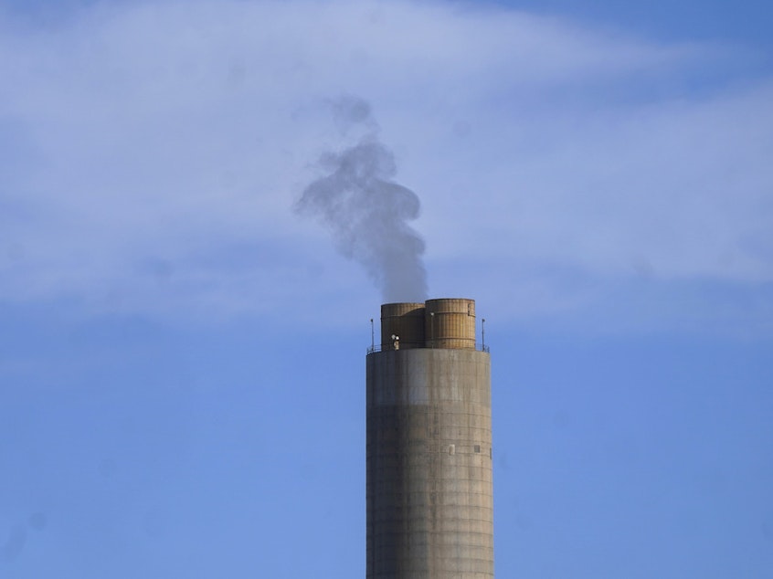 caption: A smokestack stands at a coal plant on June 22, 2022, in Delta, Utah. The Environmental Protection Agency issued a final rule Wednesday to restrict smokestack emissions from power plants and other industrial sources that burden downwind areas with smog-causing pollution they can't control. (