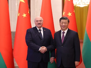 caption: Belarus' President Alexander Lukashenko meets with Chinese leader Xi Jinping in Beijing on Wednesday.
