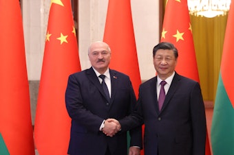 caption: Belarus' President Alexander Lukashenko meets with Chinese leader Xi Jinping in Beijing on Wednesday.