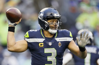 caption: Russell Wilson of the Seattle Seahawks passes against the Detroit Lions during the third quarter at Lumen Field in January in Seattle, Wash.