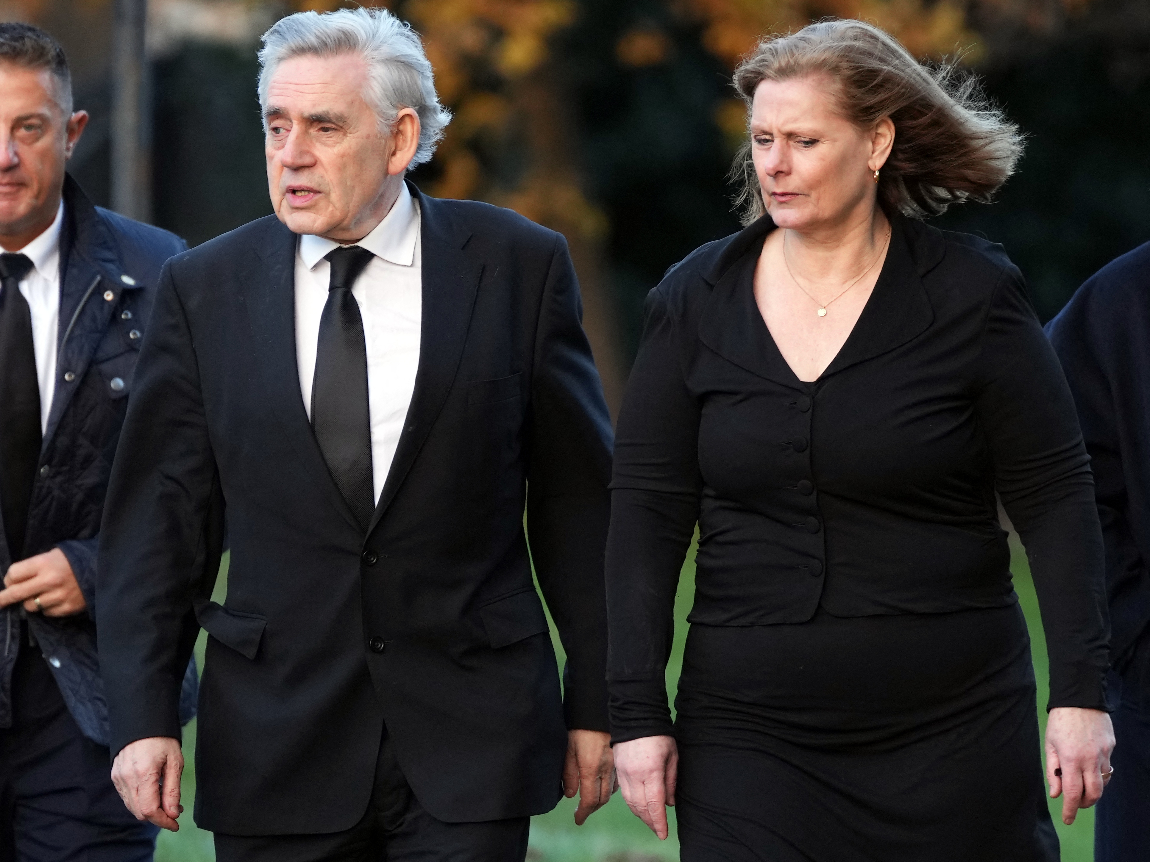 caption: Former British Prime Minister Gordon Brown, shown here with his wife Sarah in 2023, says Rupert Murdoch's U.K. tabloids hacked into his voicemails and documents to learn private information about him and his family. A 2011 police memo shows Washington Post CEO Will Lewis, then working for Murdoch, cited a security threat involving Brown as a reason to delete company emails. 
