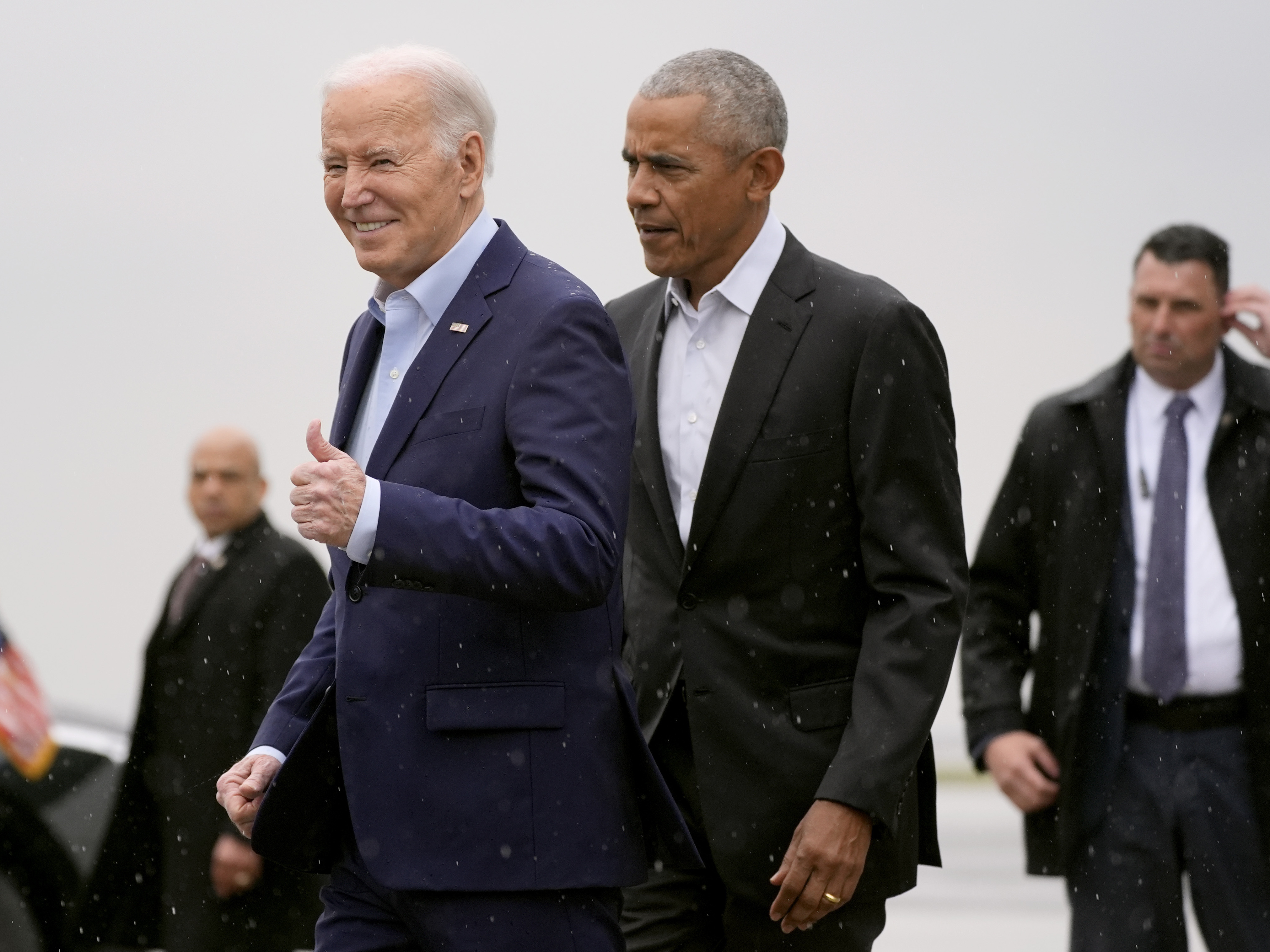 caption: President Joe Biden, left, and former President Barack Obama arrive on Air Force One at John F. Kennedy International Airport, Thursday, March 28, 2024, in New York. (AP Photo/Alex Brandon)