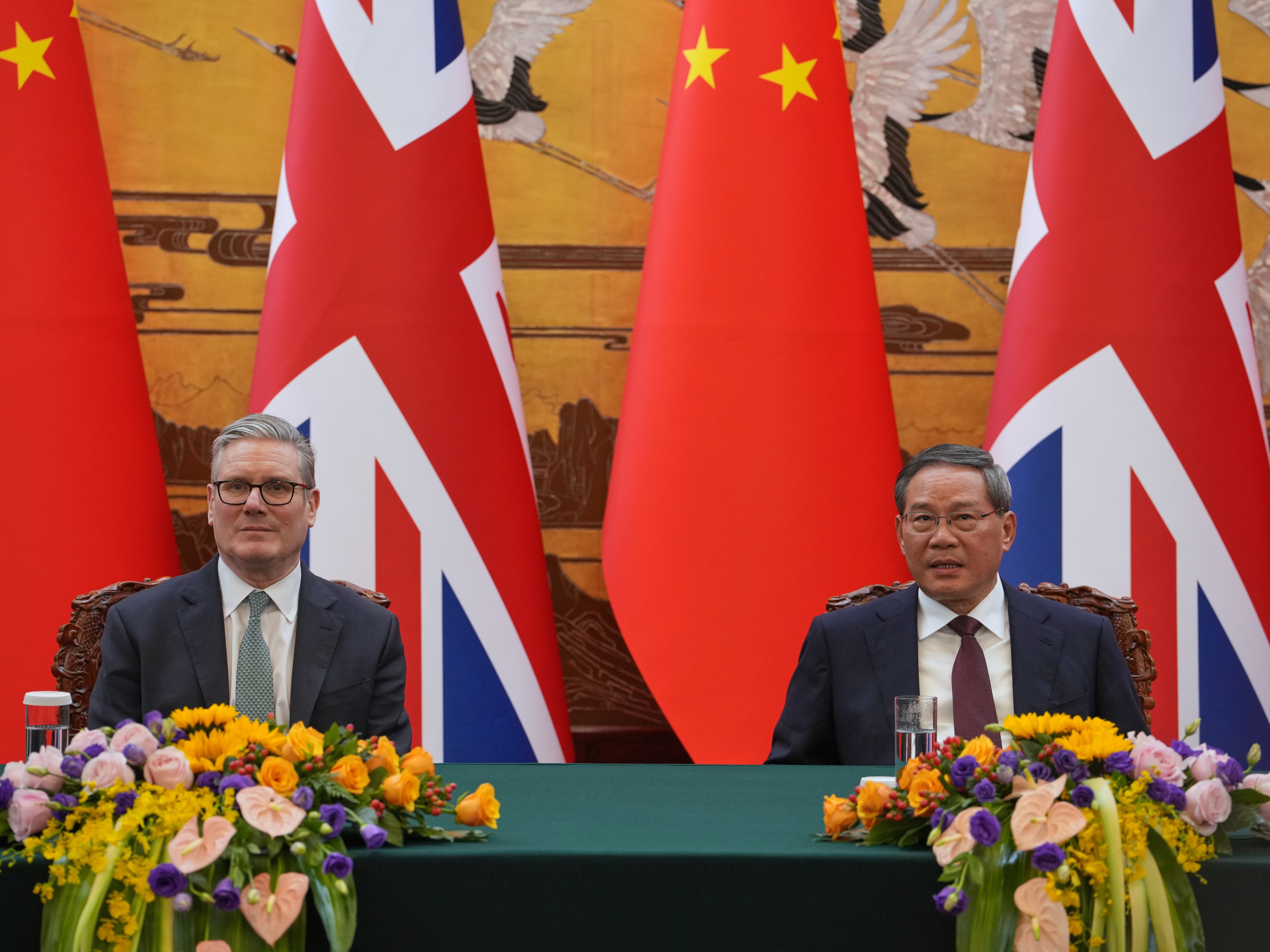 caption: Britain's Prime Minister Keir Starmer, left and Chinese Premier Li Qiang attends a signing ceremony held at the Great Hall of the People in Beijing, China, Thursday, Jan. 29