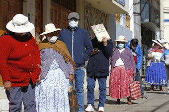 caption: People in the Andean city of Puno, Peru, lined up earlier this month to withdraw funds from their pensions. The World Food Programme says the number of people experiencing severe  food insecurity in Latin America and the Caribbean could quadruple.