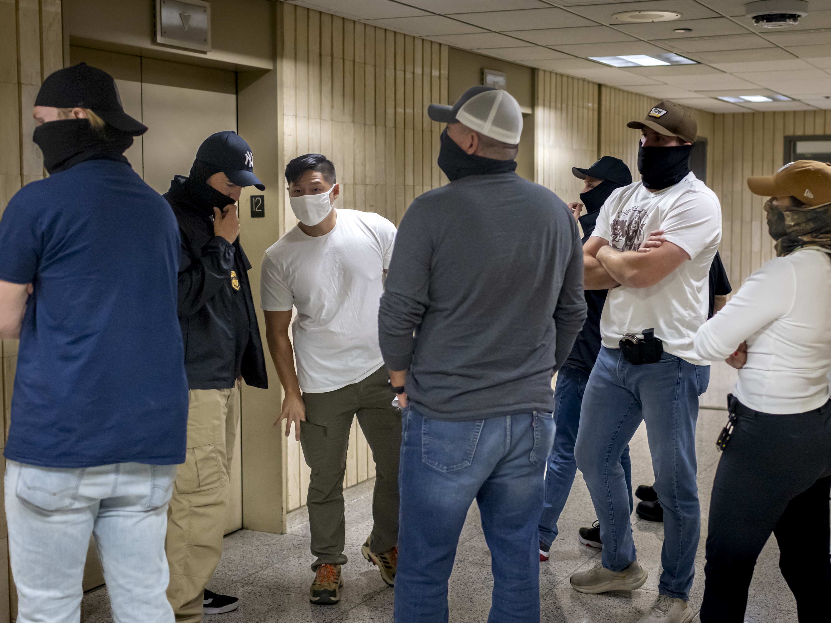 caption: Federal agents patrol the halls of immigration court at the Jacob K. Javitz Federal Building. Immigration and Customs Enforcement (ICE) agents and other federal agencies continue to make detainments in immigration courts as people attend their court hearings.