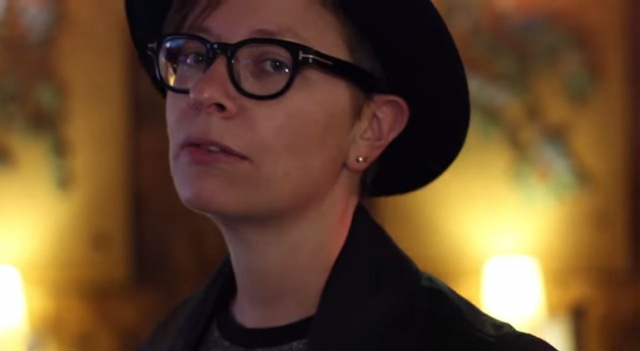 caption: Local musician Jamie Aaron, in a screenshot from one of her music videos.