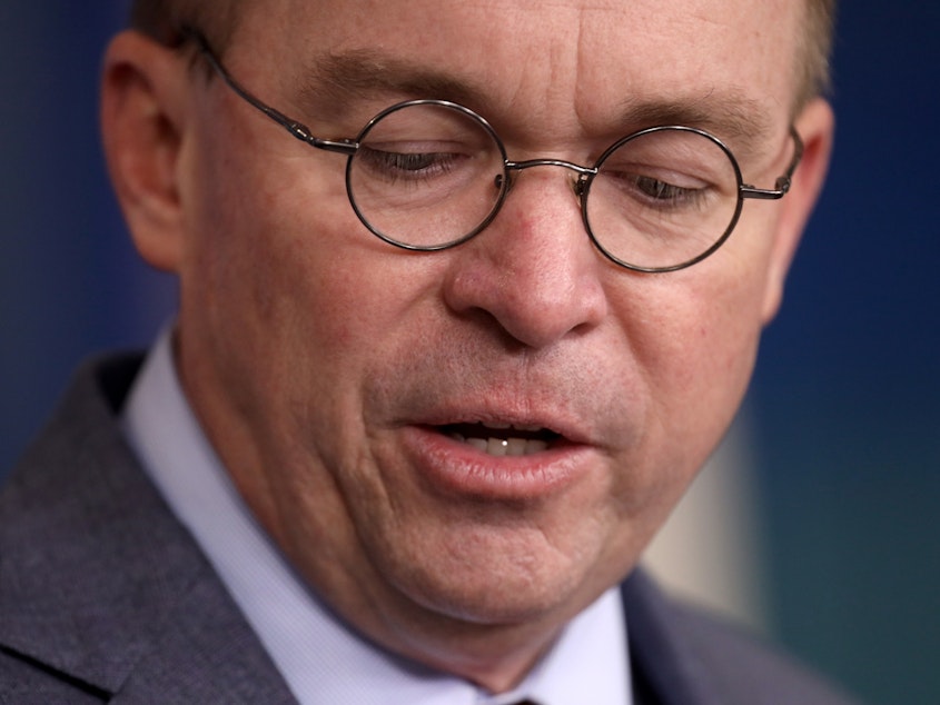 caption: President Trump's acting Chief of Staff Mick Mulvaney answers questions at the White House on Oct. 17. Win McNamee/Getty Images