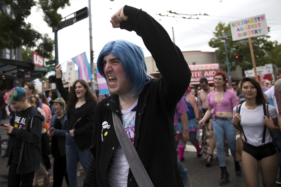 caption: Katherine Robichaux, 27, chants during the Trans Pride Seattle march on Friday, June 22, 2018, in Capitol Hill.