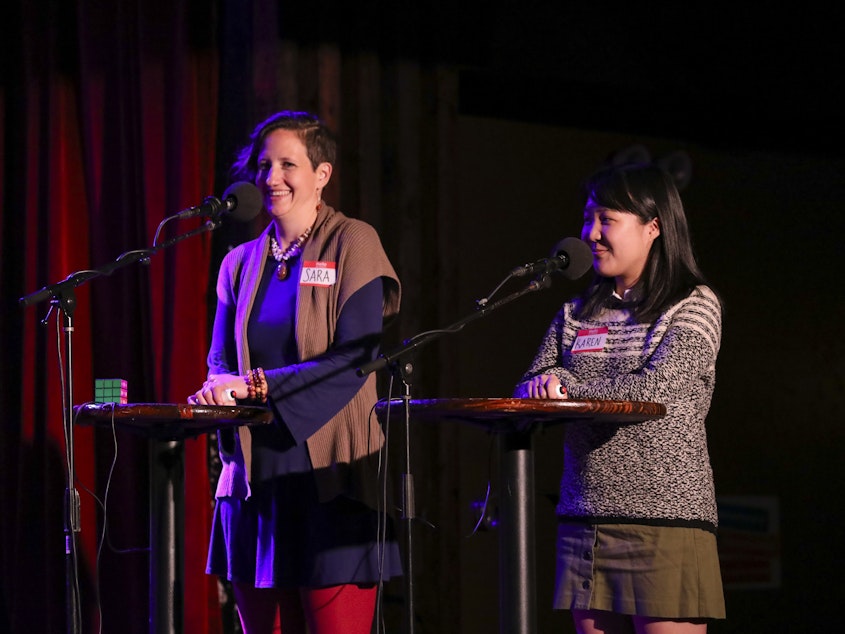 caption: Contestants compete in the final round on <em>Ask Me Another</em> at the Bell House in Brooklyn, New York.