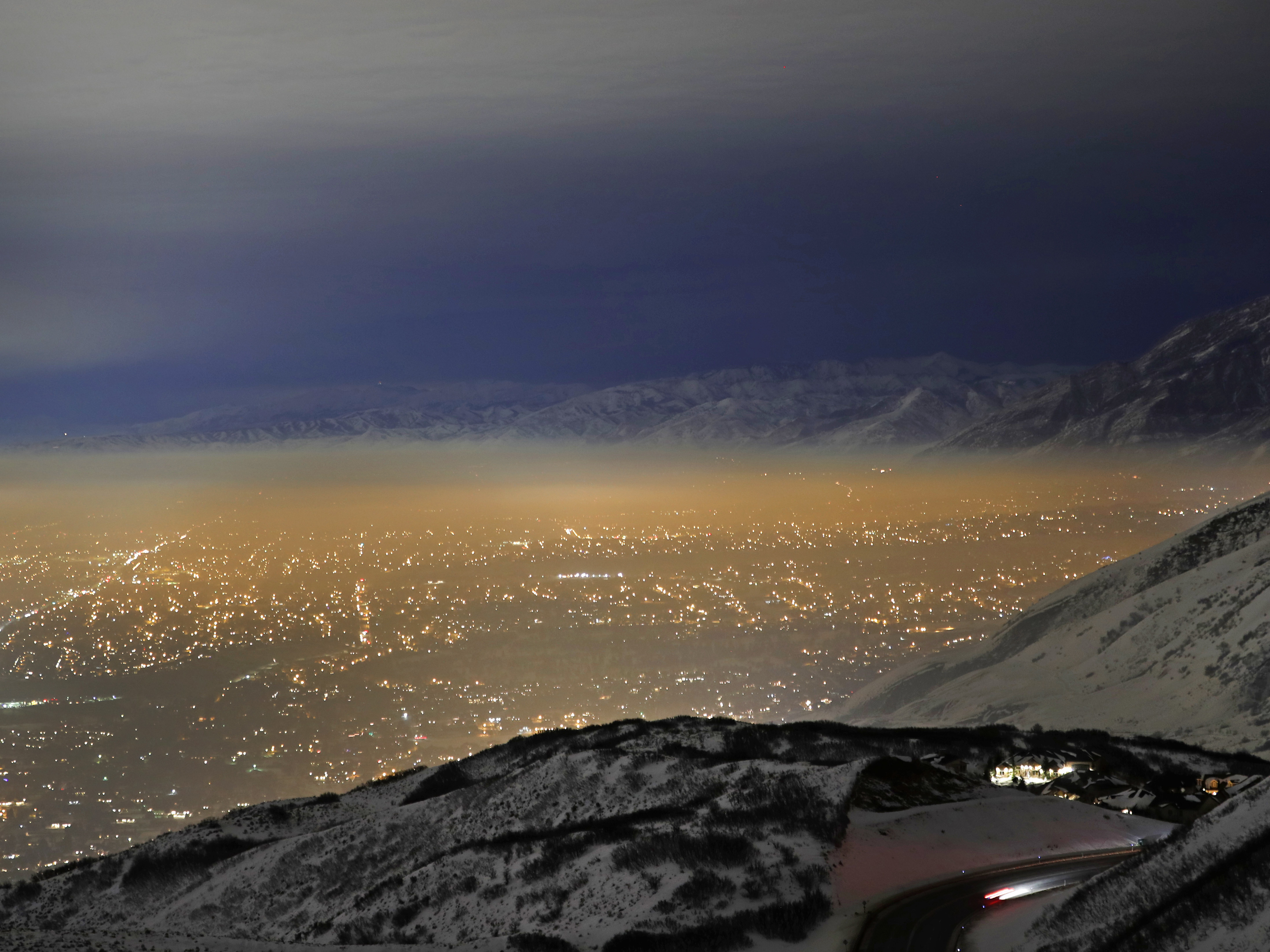 caption: Smog filled Utah's Salt Lake Valley in January 2017. Winter weather in the area often traps air pollution that is bad for public health.