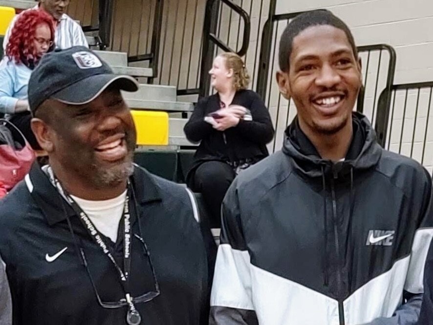 caption: Jayland Walker (right) with his former wrestling coach Robert Hubbard in February 2020.