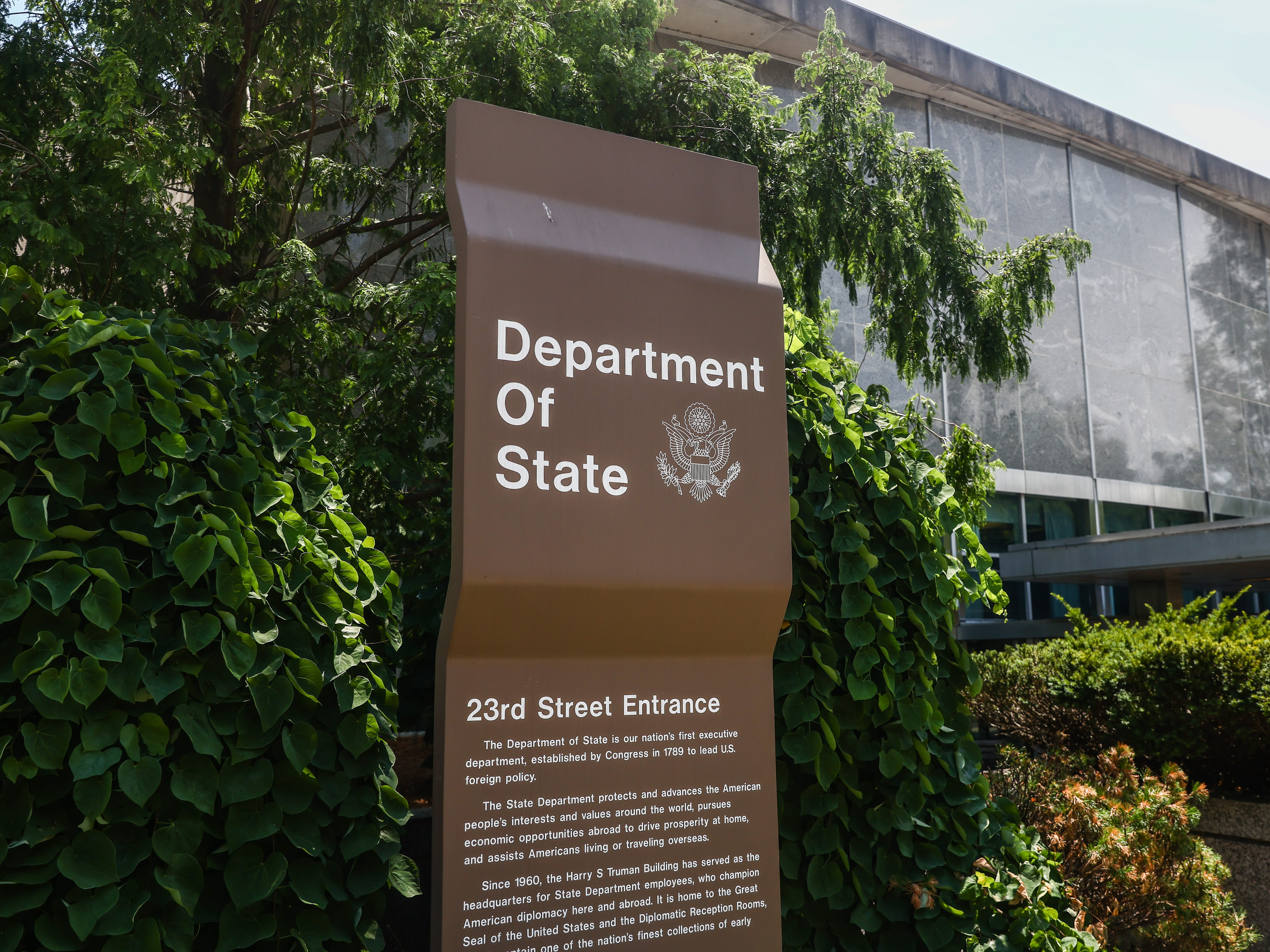 caption: The U.S. Department of State sign in Washington, D.C.