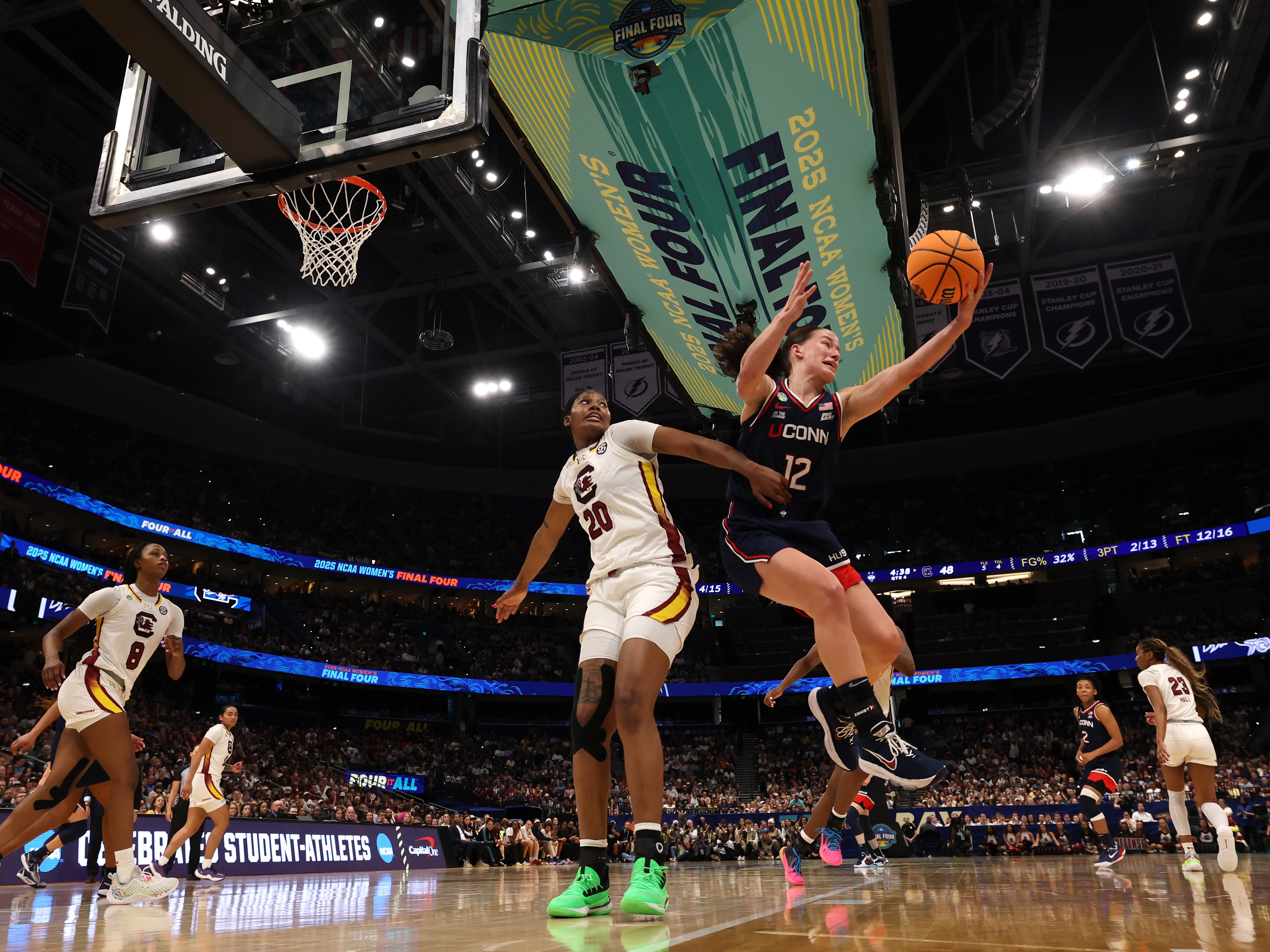 caption: The UConn Huskies defeated the University of South Carolina to win the NCAA Women's Basketball Championship on Sunday in Tampa. A class-action lawsuit involving thousands of current and former college athletes, known as House vs. NCAA, would transform college sports by allowing schools to pay players directly. A federal judge in California holds the final hearing on the lawsuit beginning Monday.