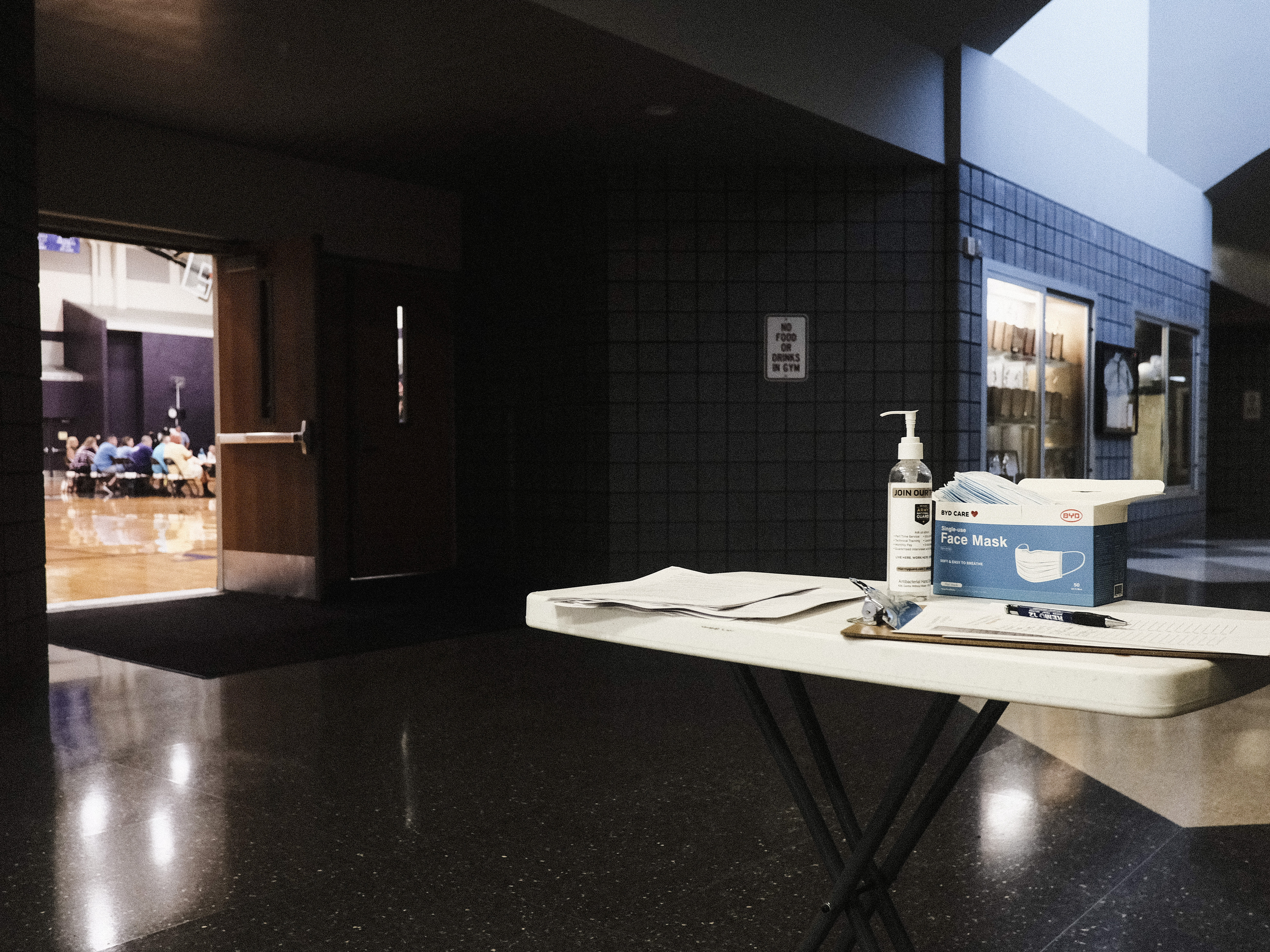 caption: People attend a special Board of Education meeting on mask mandates for students and staff in Kalamazoo County Schools at the Schoolcraft High School Gymnasium on Aug. 23 in Schoolcraft, Mich. COVID-19 protocols around the country have divided parents and school staff, in some cases leading to violence and intimidation.