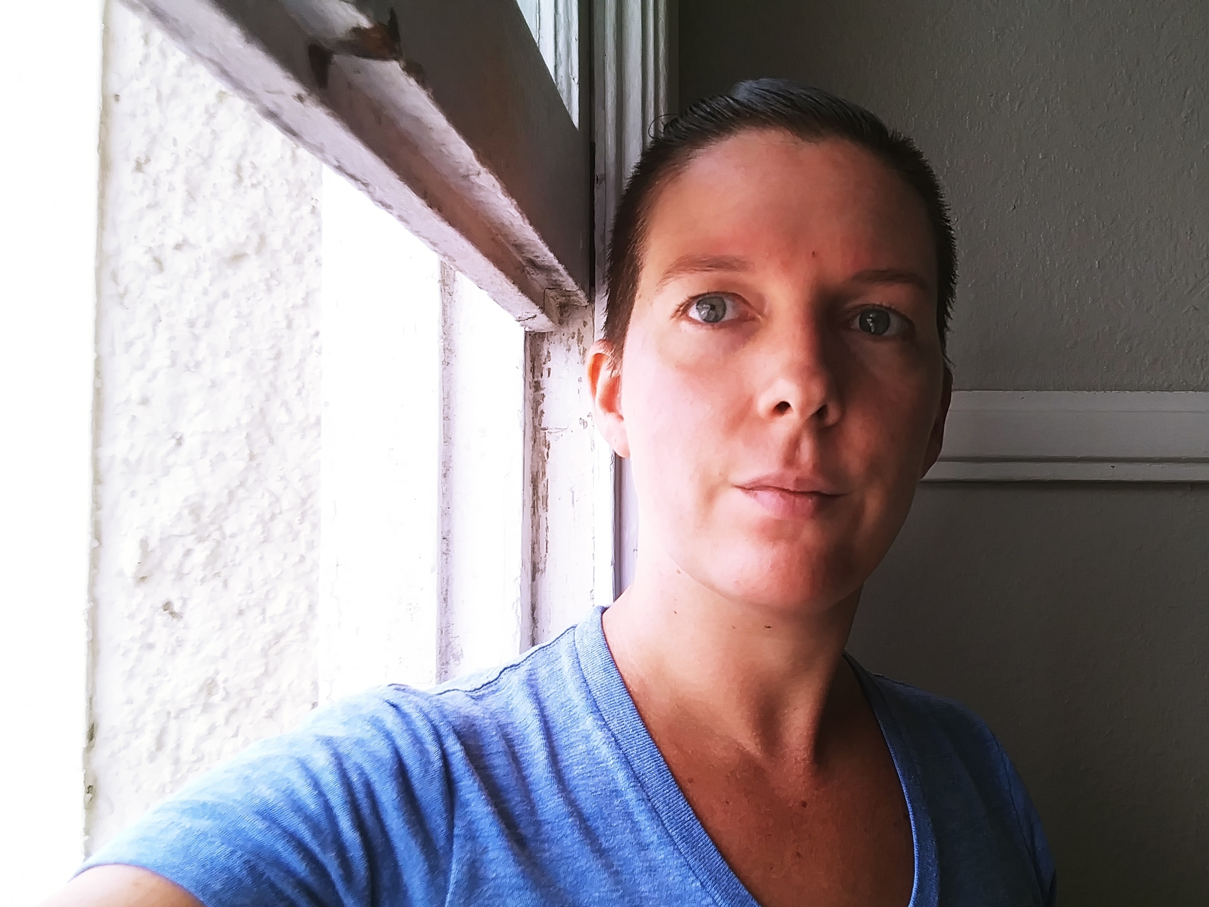 caption: "We don't have a whole lot of options that don't involve risking our lives," says New Orleans resident Lauren Van Netta, who has asthma and other health issues.