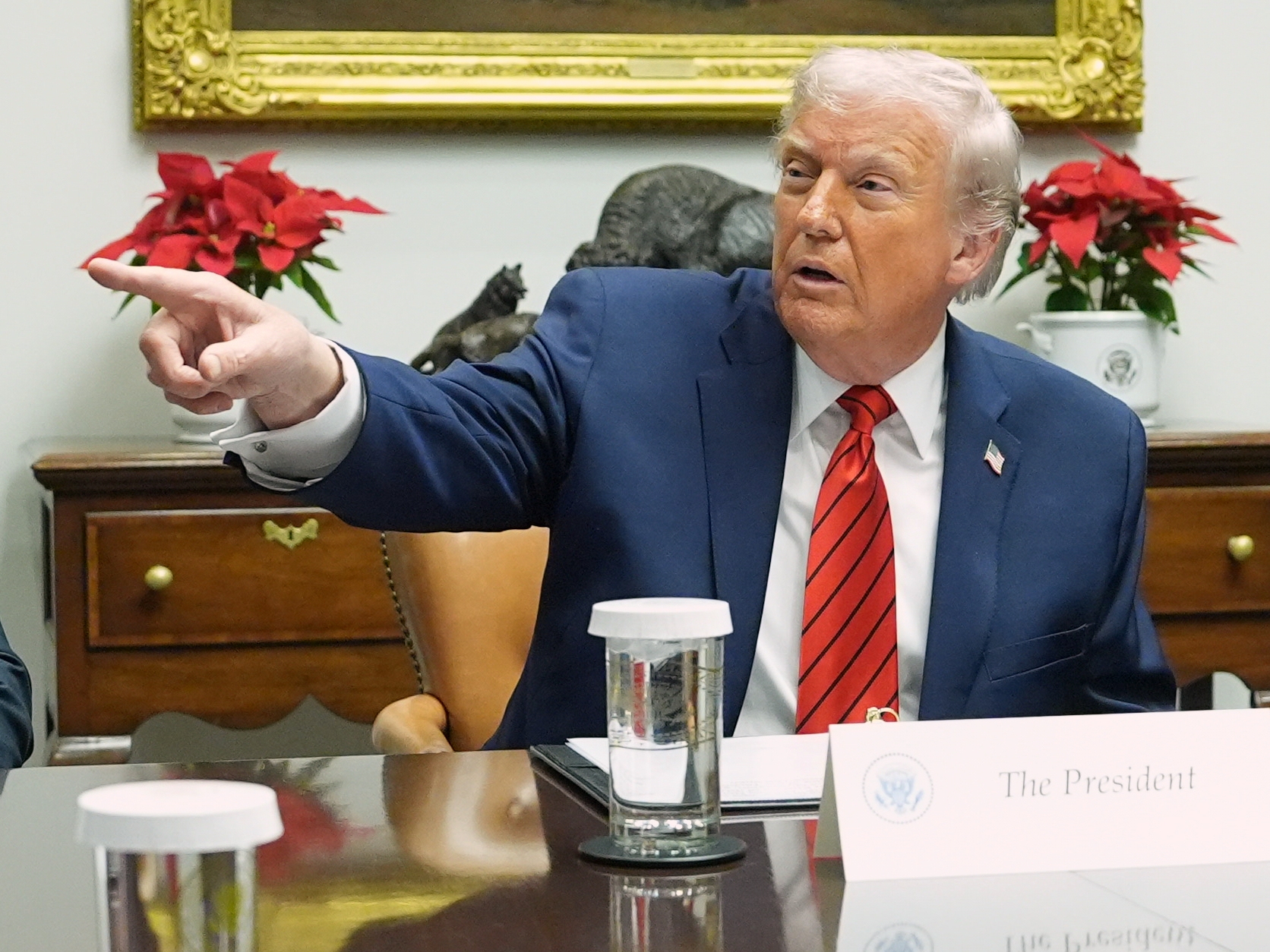 caption: President Donald Trump speaks during a roundtable in the Roosevelt Room of the White House, Wednesday, Dec. 10, 2025, in Washington.