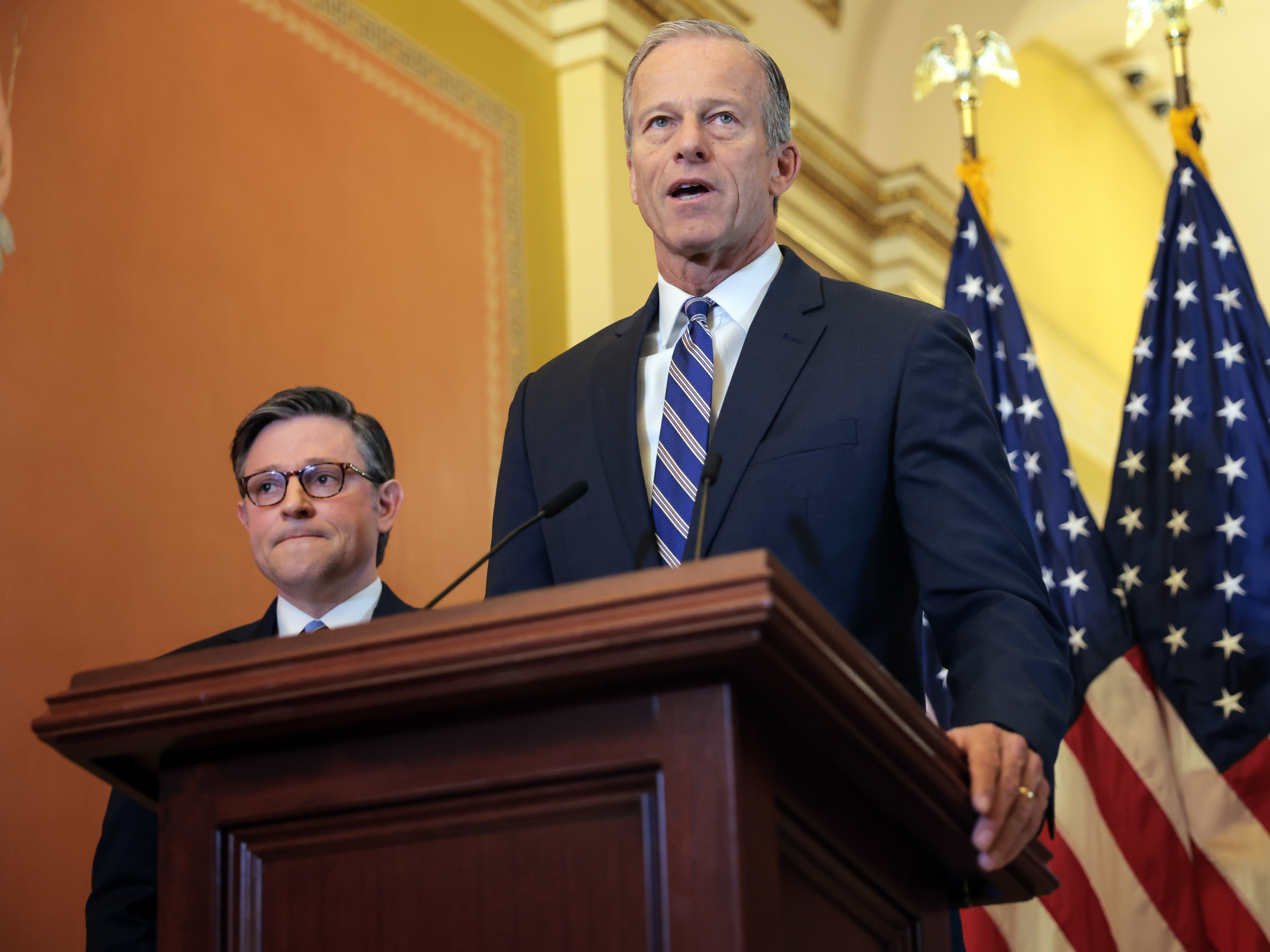 caption: Senate Majority Leader John Thune, R-S.D., (R) says he hopes to pass the Senate's massive tax and spending bill this week. If he succeeds, House Speaker Mike Johnson, R-La., (L), will have to sell the bill to holdouts in his own party if he hopes to meet President Trump's goal of signing the bill on July 4.