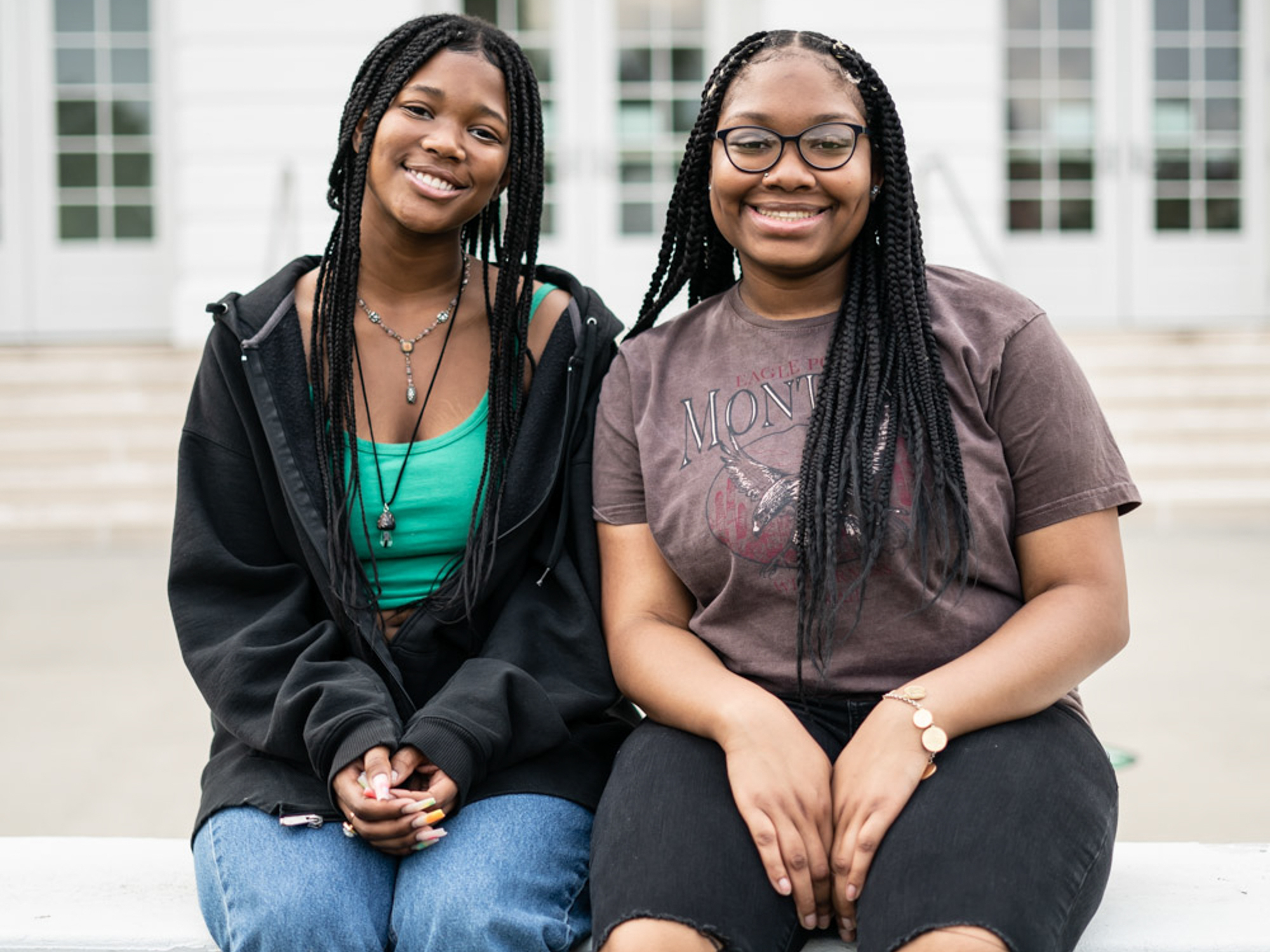 caption: Makiyah Hicks and Jonetta Harrison in front of their high school, Duke Ellington School of the Arts, in Washington, D.C. They are finalists in this year's NPR Student Podcast Challenge for their entry "Loss and Transformation."