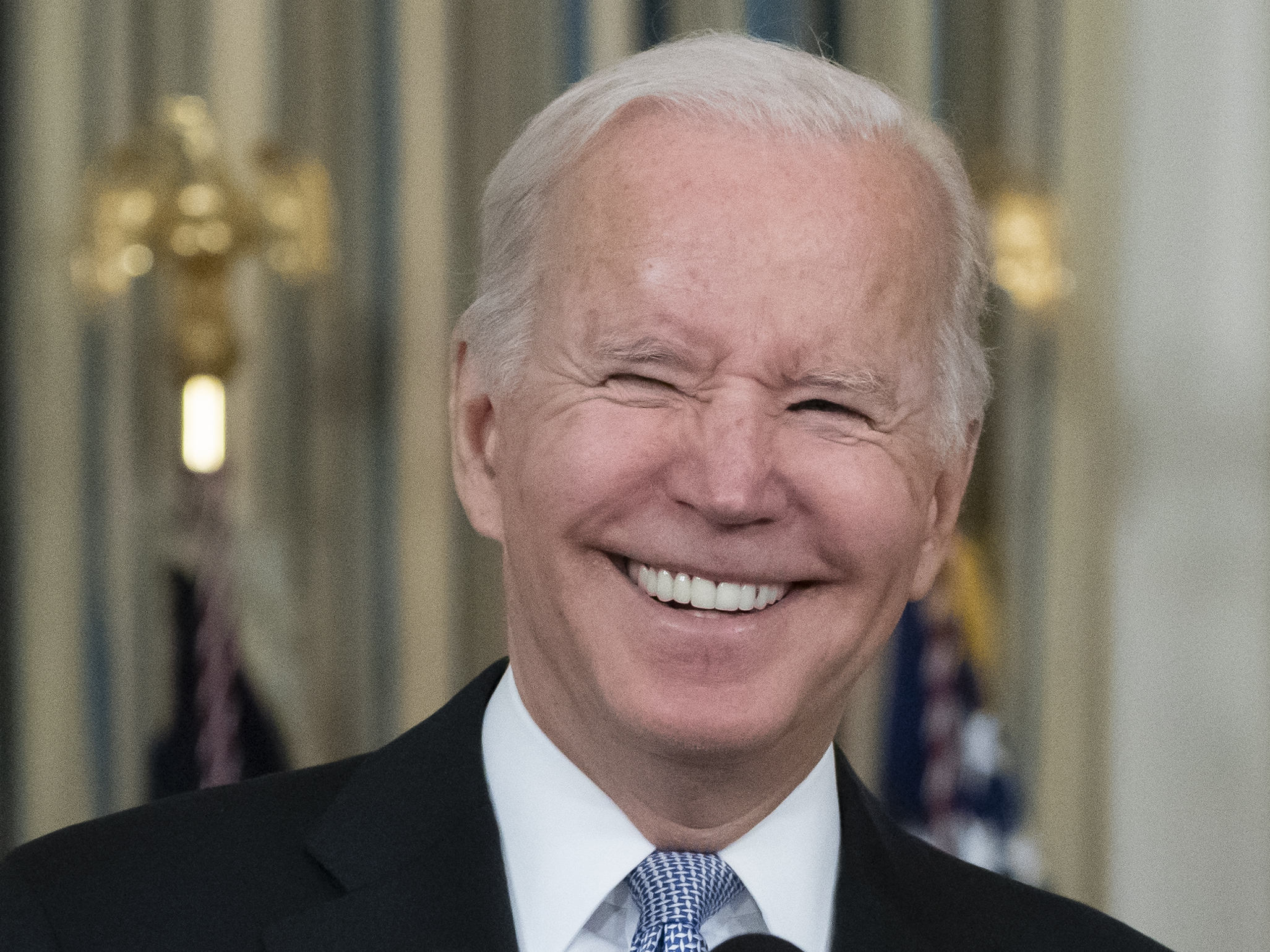 caption: President Biden was ebulliant as he described the contents of the infrastructure bill and what it took to get it across the finish line.